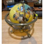 A modern coloured plastic terrestrial globe in gilt metal gimbal stand