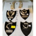 Various hallmarked silver presentation teeth and animal bones mounted on plaques with animal teeth