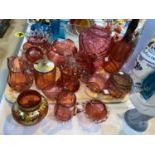 A collection of cranberry glass vases and jugs; a similar lightshade