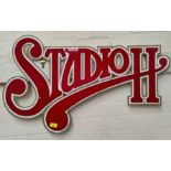 A red & white sign "Studio H"