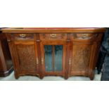 An Edwardian carved mahogany sideboard base with 3 frieze drawers, 2 side cupboards and central