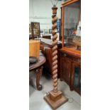 An oak heavy barley twist standard lamp