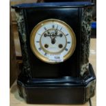 A 19th century mantel clock with visible escapement and French striking movement in black and