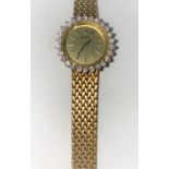 An 18 carat gold Rolex dress watch fitted with factory set diamond to the bevel (26 in total) with
