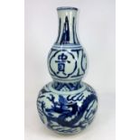 A Chinese blue and white double gourd vase with dragon decoration, height 31cm