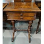 A 19th century walnut work table with fold-over rectangular top, fitted 2 drawers, on turned legs