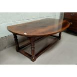 A distressed oak drop leaf coffee table