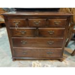 A period style oak chest of two long, two short and two frieze drawers.