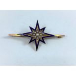 An Edwardian 'star' bar brooch in yellow metal and blue enamel, set seed pearls, unmarked, tests