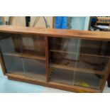 A teak mid century sliding glass door bookcase