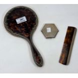 A hallmarked silver and tortoiseshell hand mirror and comb, Birmingham 1922; a hallmarked silver