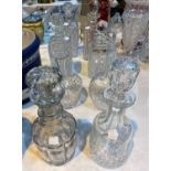 A pair of cut glass decanters, 26 cm; 6 others
