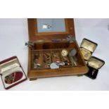 A jewellery box with a selection of gent's jewellery: tiepins; cufflinks; etc.