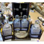 A 19th century Coromandel cased 4 bottle Tantalus with hinged top containing 4 later glasses &