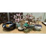 A modern Japanese lacquer style circular box, stone bonsai trees