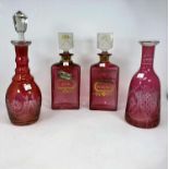 A pair of pink rectangular decanters, lettered in gilt 'Whisky' & 'Rum'; 2 pink overlaid