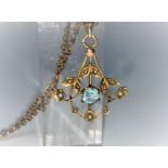 A Art Nouveau aquamarine coloured and seed pearl pendant, on plated chain