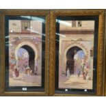 A pair of 1920's colour prints Middle Eastern scenes, ornate gilt frames 80 x 46 cm overall