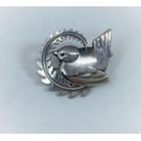 A Georg Jensen silver brooch designed by Arno Malinowski, wren perching on a frond of fern,