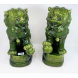 A Chinese pair of modern dogs of Fo with green glaze, height 36 cm
