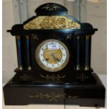 A 19th century mantel clock with French striking movement, the case in the form of a classical
