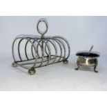 A hallmarked silver arched toast rack of 6 divisions, on bun feet, Birmingham 1903; a silver small