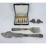 A white metal nurses belt buckles, a boxed set of six enamel Danish silver tea spoons (some loss