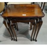 A nest of three period style mahogany coffee tables.