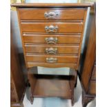 An Edwardian mahogany 5 height music cabinet with open shelf under