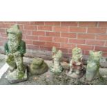 Four reconstituted stone garden ornaments: gnome; cat; etc.