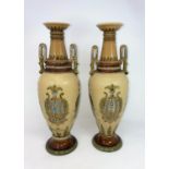 A pair of Mettlach stoneware baluster vases with Art Nouveau decoration against a light brown
