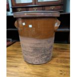 An early 20th century terracotta bread crock with riveted wooden cover 42 cm high