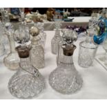 A pair of cut crystal ships decanters with silver rims; 6 other decanters