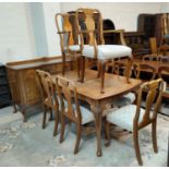 A period style burr walnut dining suite, comprising: a large extending dining table, 6 chairs (5+1),
