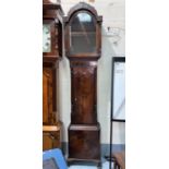 A Georgian mahogany longcase clock case, the arched hood with fretwork pediment and turned side
