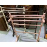 Four towel rails; a Lloyd loom linen basket