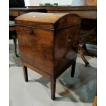 An early 19th century mahogany dome top cellaret, the hinged top enclosing 9 interior divisions,