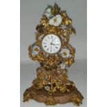 An unusual 18th century Rococo mantel clock formed from pierced and embossed gilt metal foliage with