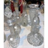 Five cut glass decanters and a vase, 23-42 cm