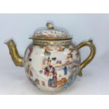 A Chinese tea pot decorated with various traditional scenes with highlights of gilt decoration (