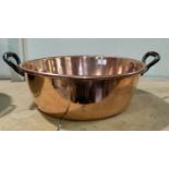 A 19th century copper jam pan; a brass footman