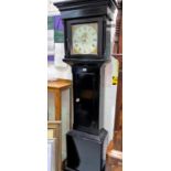 An early 19th century longcase clock in ebonised case with square top hood, square painted dial
