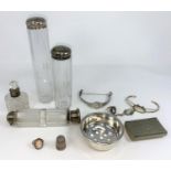 A small hallmarked strainer dish 1.25oz diameter; a slice cut glass double ended scent flask with