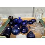 An Art Deco cut glass table lamp; a similar carafe; a selection of blue glass pieces