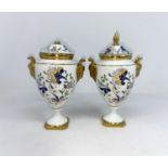 A pair of Coalport covered vases, (one finial a/f) and a decorated plates.