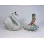 A Lladro ballet dancer; a Lladro swan; dogs of Fo; other china