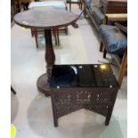 A middle eastern table with rectangular glass top, 41 cm; a pedestal table with circular top