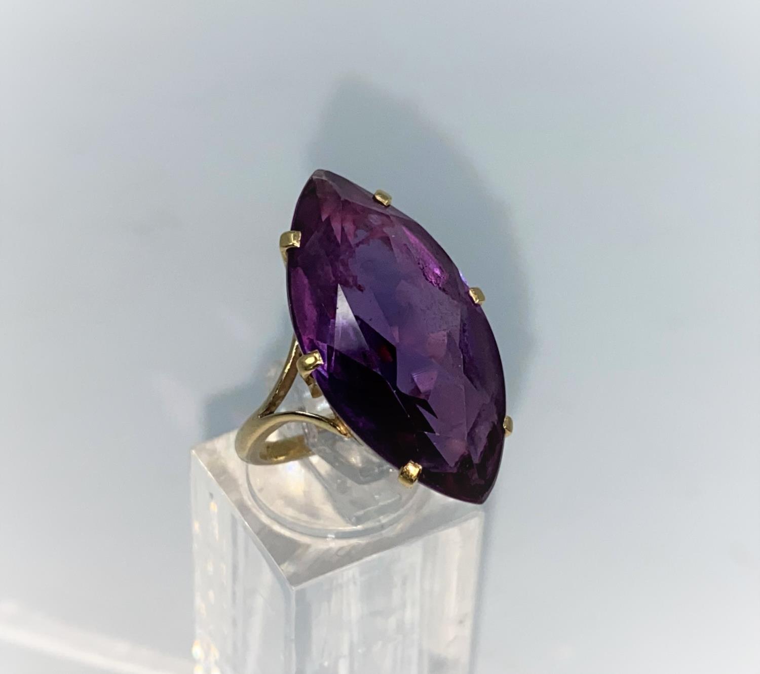 A yellow metal dress ring set with large marquise style amethyst, shank unmarked tests as 9/10 - Image 2 of 2