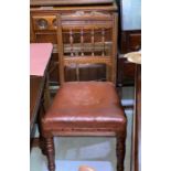 An Edwardian set of 4 oak dining chairs with spindle backs, on turned legs