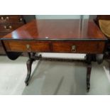 A 19th century crossbanded mahogany sofa table with frieze drawers, turned ringed end supports